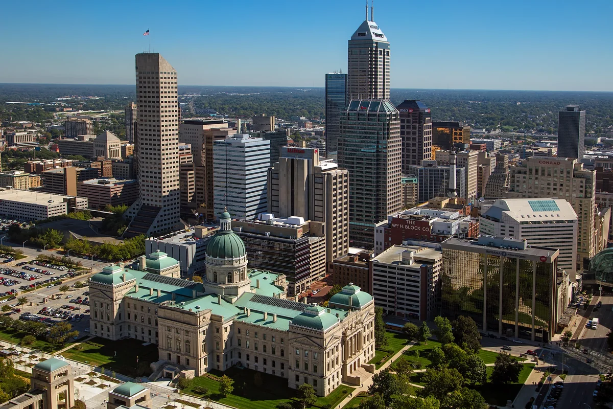 Downtown Indianapolis with the Indiana Statehouse in the foreground.